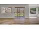 Open living area with sliding glass doors to the backyard and lots of natural light at 7813 Paper Flower Ct, Las Vegas, NV 89128