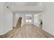 Bright, open living room with wood floors, staircase, and plenty of natural light at 7813 Paper Flower Ct, Las Vegas, NV 89128