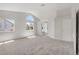 Spacious main bedroom with high ceilings, lots of natural light, and ensuite bathroom at 7813 Paper Flower Ct, Las Vegas, NV 89128