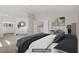 Staged main bedroom with walk in closet, ensuite bathroom, and neutral colors at 7813 Paper Flower Ct, Las Vegas, NV 89128