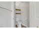 Small powder room with two shelves and modern fixtures at 7813 Paper Flower Ct, Las Vegas, NV 89128