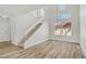Bright interior view showcasing the staircase and lots of natural light at 7813 Paper Flower Ct, Las Vegas, NV 89128
