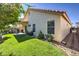 A well-maintained yard has a covered patio, landscaping, and exterior architecture at 8109 Sunset Mill Dr, Las Vegas, NV 89128