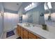 Bathroom featuring a large mirror, vanity with cabinet, and a shower with curtain at 8109 Sunset Mill Dr, Las Vegas, NV 89128