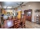 Open-concept dining room and kitchen featuring hardwood floors and wood cabinets at 8109 Sunset Mill Dr, Las Vegas, NV 89128