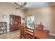 Dining room features a dark wood table and chairs, hardwood floors, and a china cabinet at 8109 Sunset Mill Dr, Las Vegas, NV 89128
