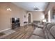 Spacious living area featuring wood floors, neutral tones, and a comfortable seating arrangement at 8109 Sunset Mill Dr, Las Vegas, NV 89128