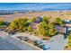This aerial view showcases a home with mature trees, lush landscaping, and a multi-car garage at 8365 S Hauck St, Las Vegas, NV 89139