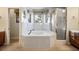 Bright bathroom with a large soaking tub and a separate glass enclosed shower at 8365 S Hauck St, Las Vegas, NV 89139