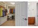 Walk-in closet with custom shelving and hanging space adjoins the bathroom at 8365 S Hauck St, Las Vegas, NV 89139