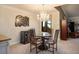 Charming dining area featuring stylish chairs, a glass-top table, chandelier, and a wine cooler at 8365 S Hauck St, Las Vegas, NV 89139