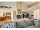 Open-concept living room featuring a fireplace and easy access to the kitchen at 8365 S Hauck St, Las Vegas, NV 89139