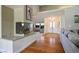 Open-concept living room showcasing a fireplace, hardwood flooring and lots of natural light at 8365 S Hauck St, Las Vegas, NV 89139