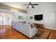Cozy living room with hardwood floors, large sectional sofa and ceiling fan at 8365 S Hauck St, Las Vegas, NV 89139