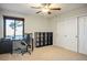 Functional home office with a desk, storage, and ample natural light at 8365 S Hauck St, Las Vegas, NV 89139