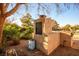 Outdoor stone kitchen with built-in grill, perfect for entertaining on the patio at 8365 S Hauck St, Las Vegas, NV 89139