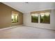 Spacious bedroom featuring neutral carpeting, recessed lighting and windows offering abundant natural light at 8365 S Hauck St, Las Vegas, NV 89139