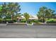 Lovely single-story home with manicured landscaping, mature trees, and an inviting entrance at 8365 S Hauck St, Las Vegas, NV 89139