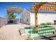 Backyard garden featuring raised garden beds, an outdoor structure and covered parking at 8365 S Hauck St, Las Vegas, NV 89139