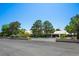 House exterior featuring a front yard with mature shade trees and a long driveway at 8365 S Hauck St, Las Vegas, NV 89139