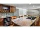 Large kitchen island features granite countertops and stainless steel appliances at 8365 S Hauck St, Las Vegas, NV 89139