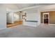 Open living space featuring hardwood flooring in one area and carpet in another at 8365 S Hauck St, Las Vegas, NV 89139