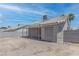 This home features a spacious backyard with covered patio and block wall at 887 Cozy Valley St, Henderson, NV 89015