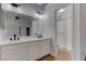 Main bathroom featuring dual sinks, quartz counters, sleek lighting, and glass shower at 887 Cozy Valley St, Henderson, NV 89015
