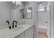 Stylish bathroom features modern fixtures, vanity with quartz countertops, and shower over tub at 887 Cozy Valley St, Henderson, NV 89015