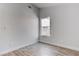 Neutral bedroom with wood-look floors and a window that offers natural light and views at 887 Cozy Valley St, Henderson, NV 89015