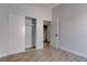 Light bedroom with wood-look floors and sliding closet doors, creating a clean and inviting space at 887 Cozy Valley St, Henderson, NV 89015