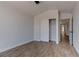 Light bedroom with wood-look floors and sliding closet doors, creating a clean and inviting space at 887 Cozy Valley St, Henderson, NV 89015