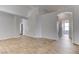 Living room featuring wood look tile floors, recessed lighting, and arched doorways at 887 Cozy Valley St, Henderson, NV 89015