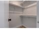 A practical walk-in closet features white shelving and wooden floors, offering ample storage space at 887 Cozy Valley St, Henderson, NV 89015