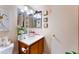 Bathroom with vanity, white countertop sink, decorative wall art and multiple mirrors for added visual appeal at 904 Boulder Springs Dr # 102, Las Vegas, NV 89128