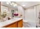 Clean, well-lit bathroom with a single sink vanity, a shower-tub combo, and a marble-tiled floor at 904 Boulder Springs Dr # 102, Las Vegas, NV 89128