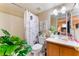 Charming bathroom featuring a decorative shower curtain, a wood vanity and a white countertop sink at 904 Boulder Springs Dr # 102, Las Vegas, NV 89128