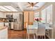 Bright dining area with stainless steel appliances and white table set adjacent to a modern kitchen at 904 Boulder Springs Dr # 102, Las Vegas, NV 89128