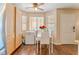 Cozy dining area featuring a white table set and stainless steel appliances, filled with natural light at 904 Boulder Springs Dr # 102, Las Vegas, NV 89128