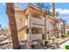 Attractive condo building with private balconies, desert landscaping, and easy access to upper floors at 904 Boulder Springs Dr # 102, Las Vegas, NV 89128