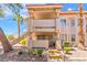 Charming two-story condo featuring private balcony, desert landscaping, and convenient stair access at 904 Boulder Springs Dr # 102, Las Vegas, NV 89128