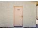Front door with unit number 102, beige door in a light-colored stucco building at 904 Boulder Springs Dr # 102, Las Vegas, NV 89128