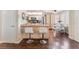 Modern kitchen with stainless steel appliances, breakfast bar, and an adjacent dining area at 904 Boulder Springs Dr # 102, Las Vegas, NV 89128