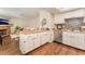 Open kitchen with a center island and modern appliances flowing into a cozy living area with fireplace at 904 Boulder Springs Dr # 102, Las Vegas, NV 89128