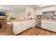 Open kitchen with a center island and modern appliances flowing into a cozy living area with fireplace at 904 Boulder Springs Dr # 102, Las Vegas, NV 89128
