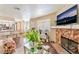 Inviting living area with fireplace and flatscreen TV, flowing into the kitchen with a bar at 904 Boulder Springs Dr # 102, Las Vegas, NV 89128