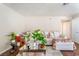 Bright living room with neutral decor, comfortable seating, and a stylish glass coffee table at 904 Boulder Springs Dr # 102, Las Vegas, NV 89128