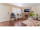 Bright living room with hardwood floors, a fireplace, and a large window providing natural light at 904 Boulder Springs Dr # 102, Las Vegas, NV 89128