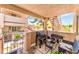 Charming patio area with a grill, seating, and views of the condo community at 904 Boulder Springs Dr # 102, Las Vegas, NV 89128