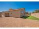 Spacious backyard with artificial turf and low-maintenance landscaping at 909 Trinity Pond Cir, Henderson, NV 89002